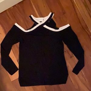 Ladies cold shoulder blouse black with white collar trim.